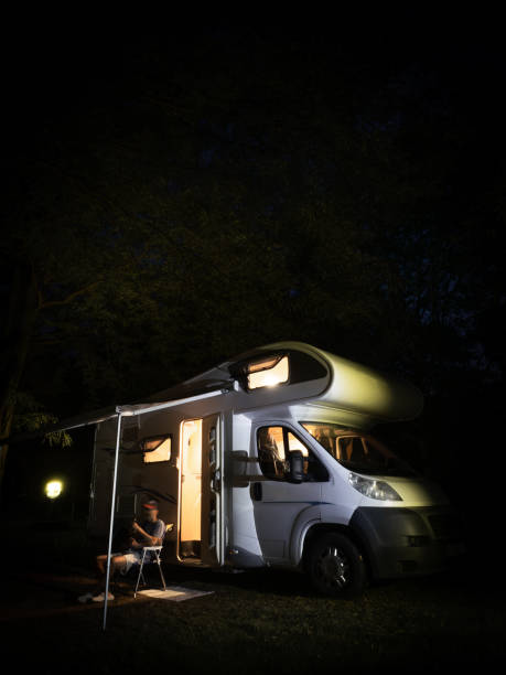istock One man  outside the motor home at night 2169935690