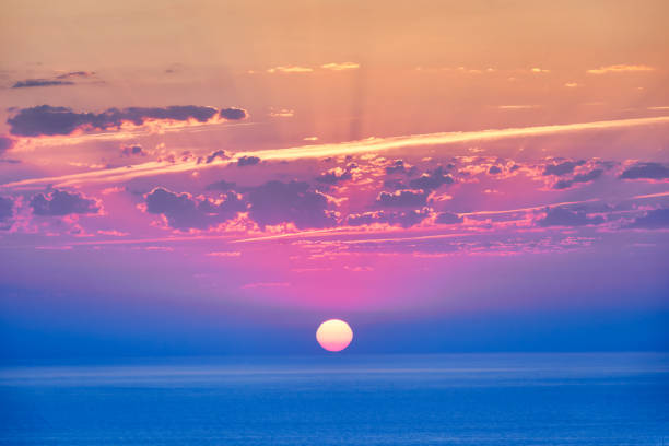 Sunrise in the Mediterranean Sea in the summer, strong color contrast, abstract and strong