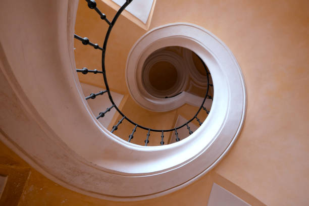 istock Low angle view of a spiral staircase 2169940755