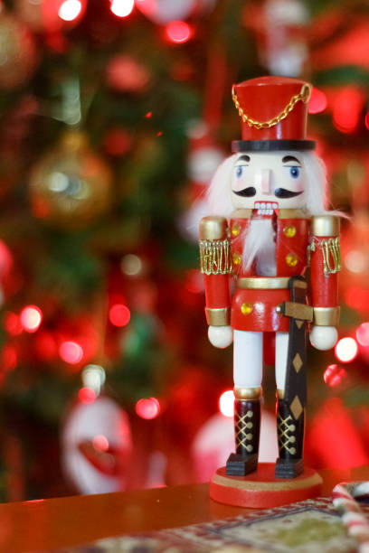 istock A red and gold nutcracker soldier figurine stands on a surface in front of a blurred 2169941651