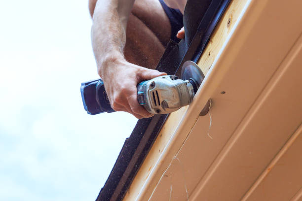 istock In employee is cutting off existing vinyl soffit plastic panels to specific size on facade ceiling of a new house 2169942043