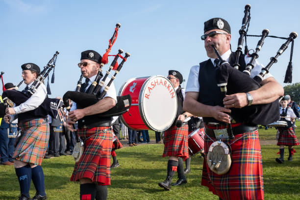 Stratford, Canada - April 2, 2023: Stratford Police Band - Pipes & Drum. Sunday’s swan celebration, one of Canada’s most unique events announcing the arrival of spring. Swans parade to the Avon river along lakeside drive on the first weekend of April.