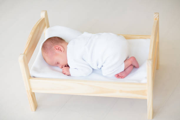 istock Little baby on toy bed 2169943287