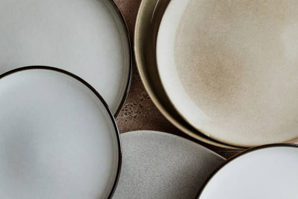istock Top view of modern various ceramic plates on a kitchen table, cooking concept. 2169944883