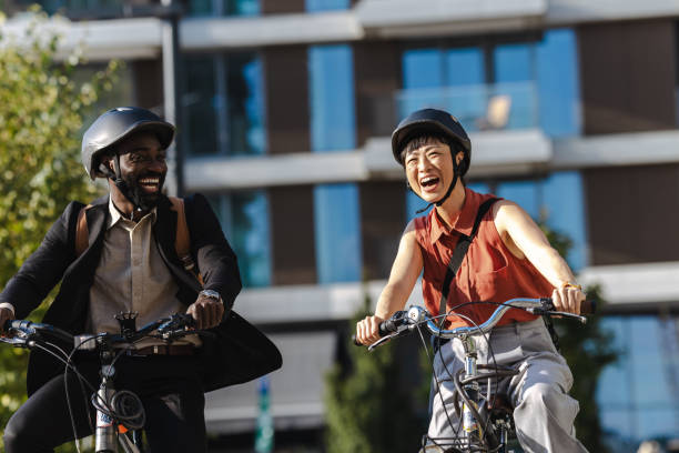 istock Two colleagues biking to work enjoy a sunny morning commute 2169944950