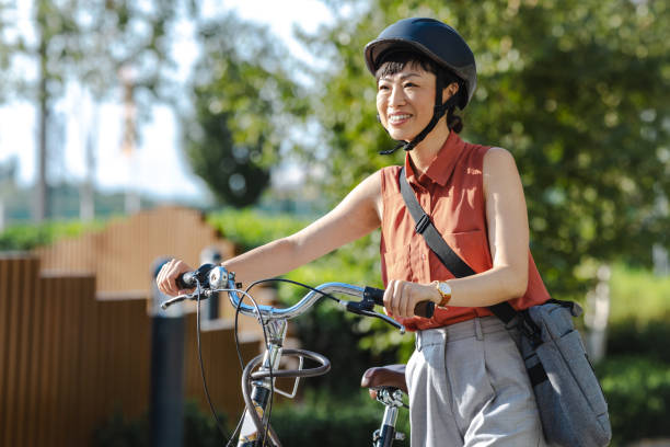 istock Smiling Japanese female commuter with her bicycle 2169944989