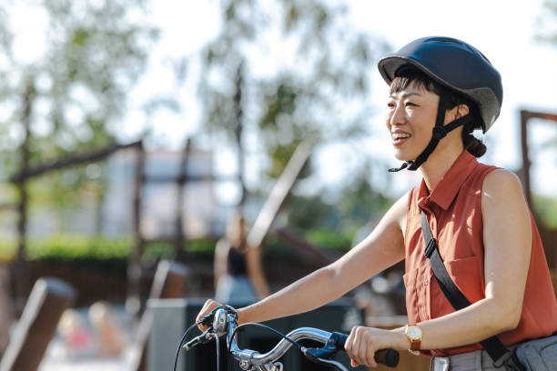 istock Smiling Japanese female commuter with her bicycle 2169944992