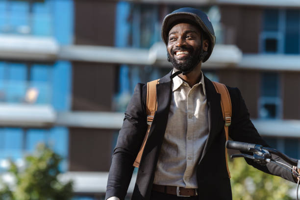 istock Businessman commuting on bicycle in urban city environment 2169945016