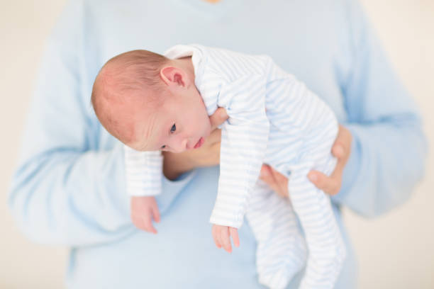istock Father holding newborn baby 2169945493