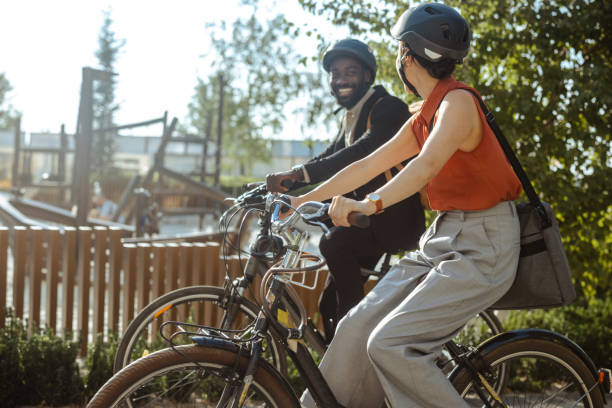 istock Two cyclists riding along a scenic path on a sunny day 2169945550