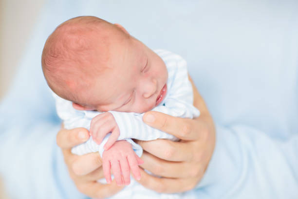 istock Father holding newborn baby 2169946134