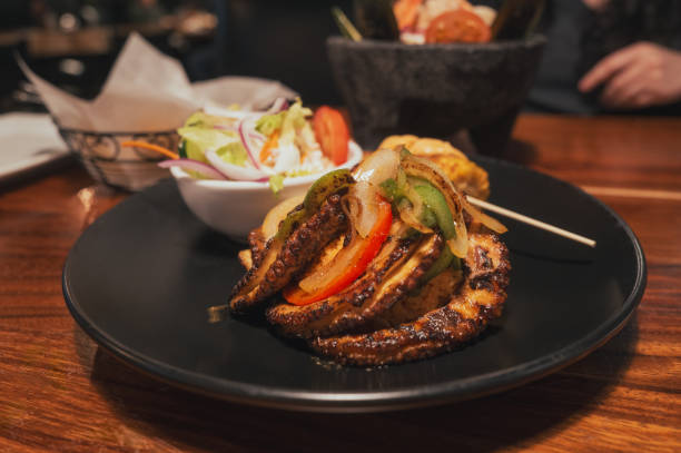 istock Grilled Octopus over Rice - Mexican Seafood Restaurant - Chips, Ceviche, Corn, Salad - Close Up 2169946452