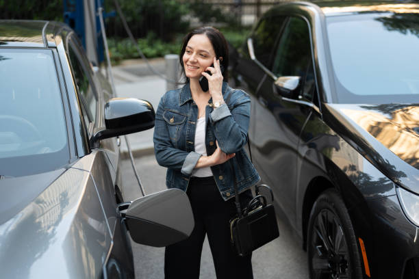 istock Woman at a Public EV Charging Station 2169946458