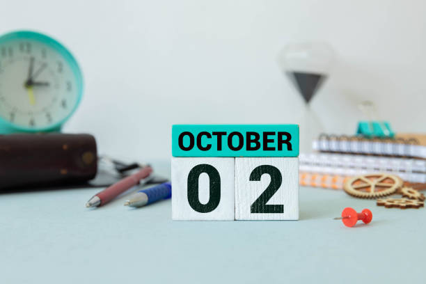 istock October 2 on a wooden calendar on a table or shelf. 2169947142