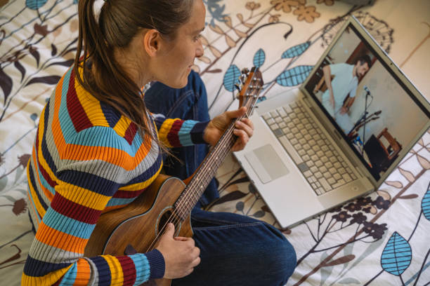 istock Woman Having Online Music Class. E-learning Guitar. 2169950698