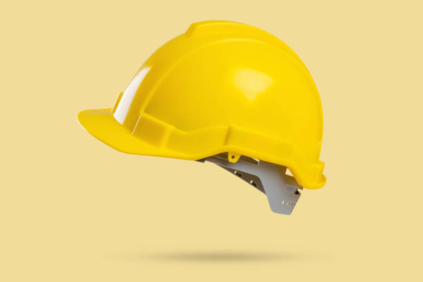 istock Safety construction helmet on yellow background 2169950701