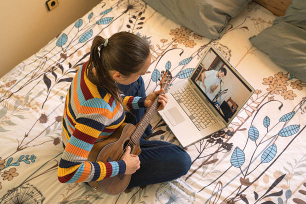 istock Woman Having Online Music Class. E-learning Guitar. 2169950703