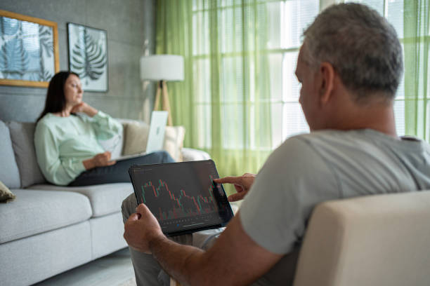 istock Smart Investor. Couple Using AI for Stock Trading. 2169951325