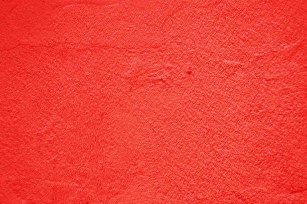 istock The surface of an old, rough concrete wall is red. 2169951440