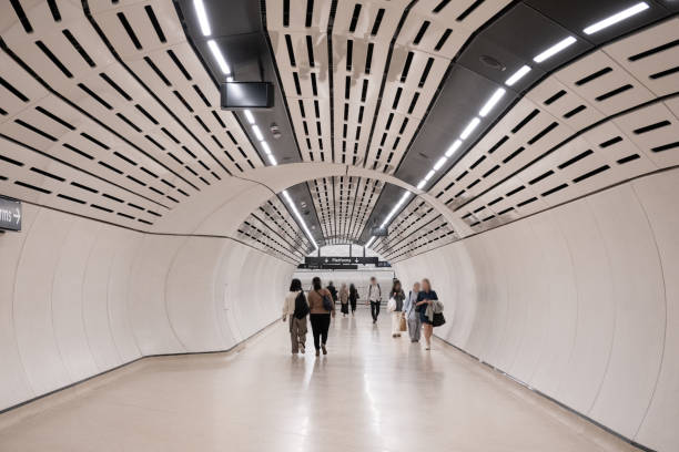 istock Obscured Inner city commuters walking through a futuristic tunnel as an example of fast pace life 2169951497