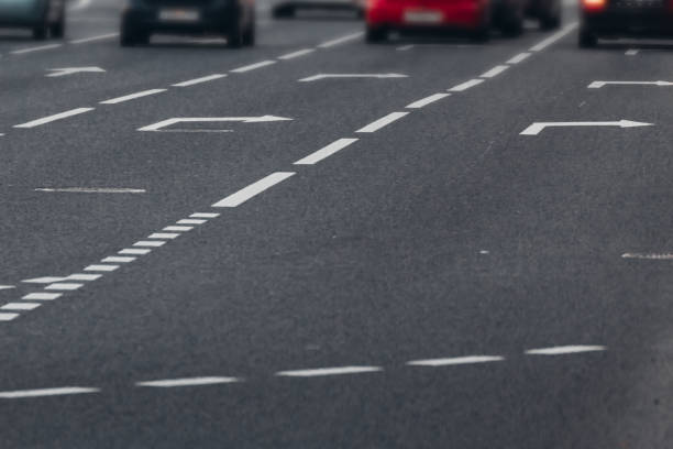 istock traffic arrows on asphalt markings 2169953195