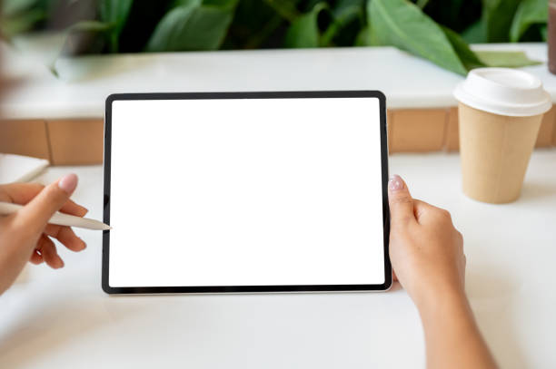 istock A close-up image of a woman working remotely from a coffee shop, using her digital tablet. 2169960317