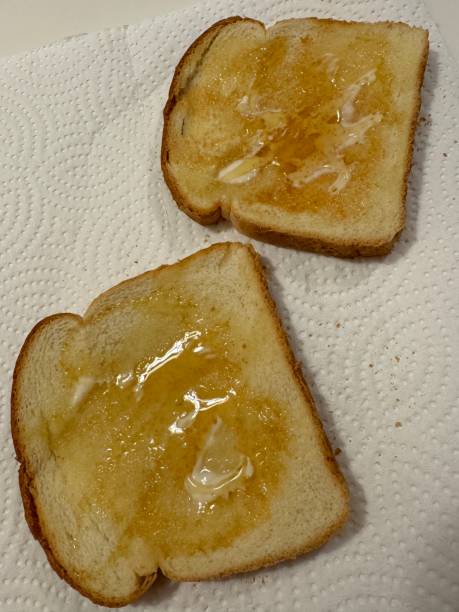 istock Buttered toast with honey 2169960474