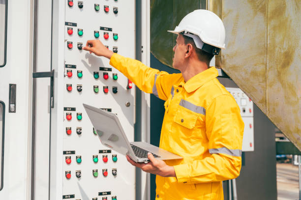 istock The electrician inspects a large-scale industrial electrical control system, focusing on the safety and stability of the electrical system. 2169964312