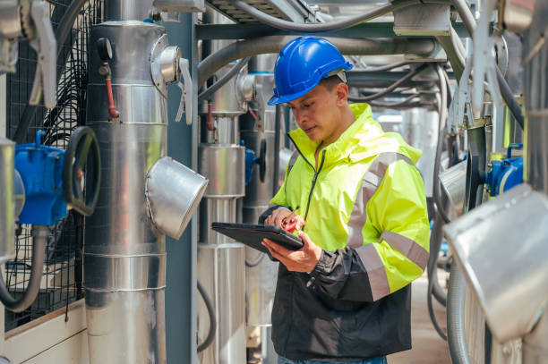 istock The technician carefully inspecting a section of pipeline during a construction project, emphasizing safety and precision in infrastructure development. 2169964317