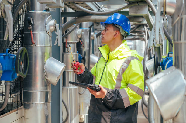 istock The technician carefully inspecting a section of pipeline during a construction project, emphasizing safety and precision in infrastructure development. 2169964318