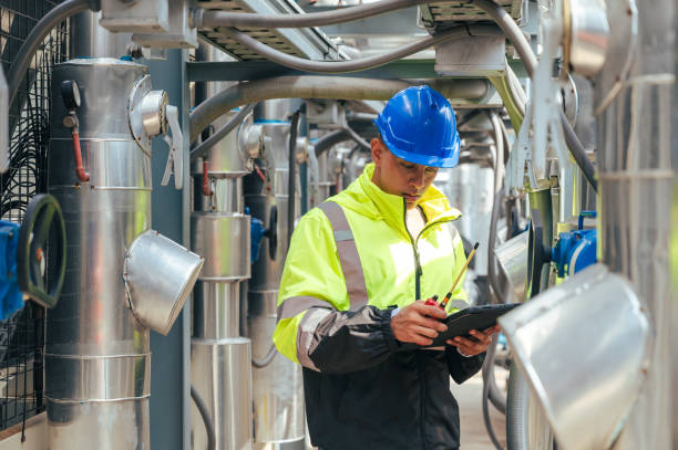istock The technician carefully inspecting a section of pipeline during a construction project, emphasizing safety and precision in infrastructure development. 2169964323