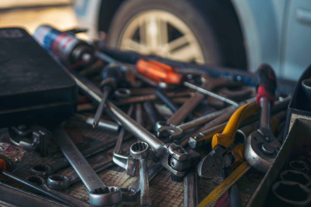 istock Mechanic tools engineering equipment car auto repair shop with copy space. Blurred background mechanical service. Heavy screw grungy rusted wrenches dirty screwdriver object. Industrial hardware set 2169964751