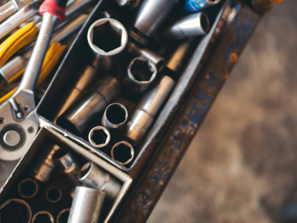 istock Mechanic tools engineering equipment car auto repair shop with copy space. Blurred background mechanical service. Heavy screw grungy rusted wrenches dirty screwdriver object. Industrial hardware set 2169964808