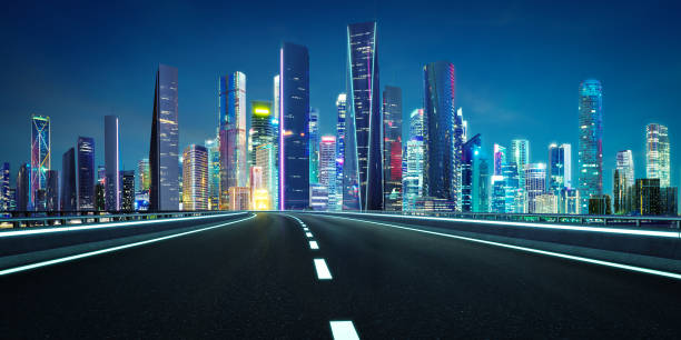 istock 3d rendering of a highway leading to a cityscape at night 2169966071