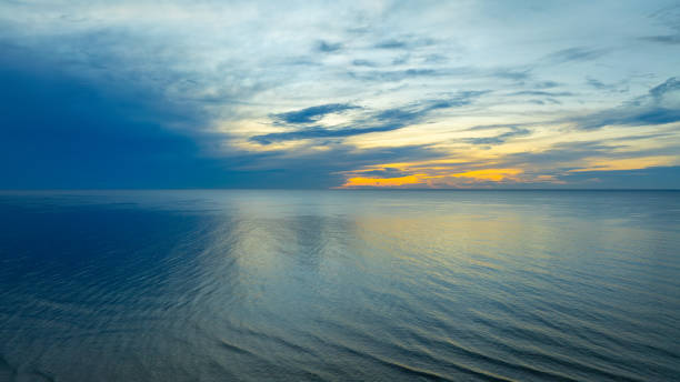 istock Skyline scenery Sunset in the evening sky with colorful clouds and beautiful cloud patterns In the soft light evening at the sea 2169969427