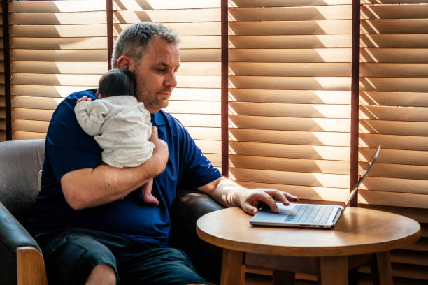 istock Father multitasking while taking care of baby girl 2169969822