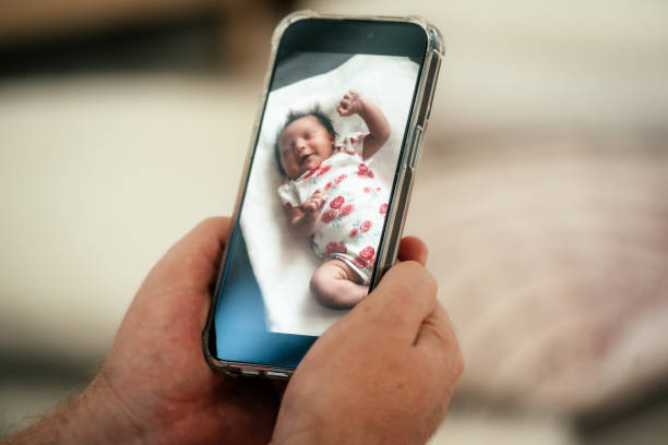 istock Cute newborn girl on screen 2169969838
