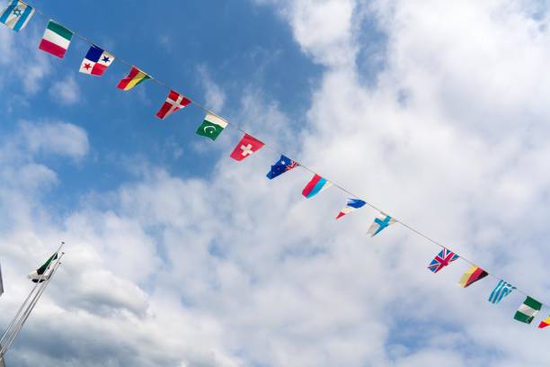 istock National flags flapping in the blue sky 2169970252