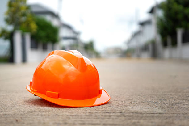istock A construction worker safety helmet or hardhat, placed on cement ground. 2169970652