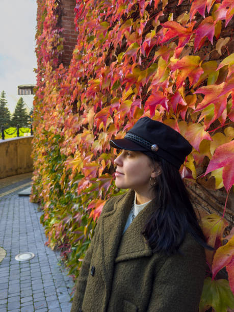 Stylish Woman in Autumn Foliage portrait