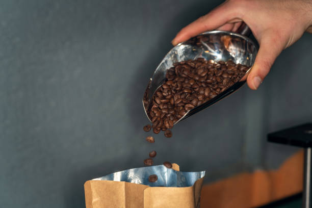 istock The man is packaging roasted coffees ready for sale. 2169973558