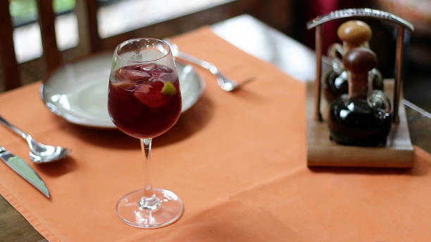 istock A wine glass filled with fruit juice and ice on a dining table 2169975763