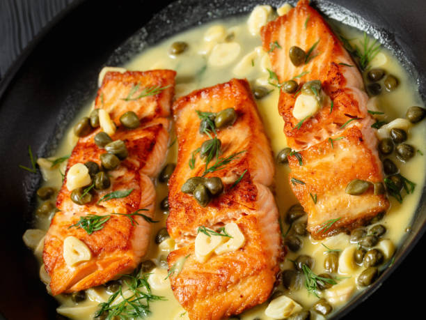 istock salmon piccata with lemon caper sauce in a pan 2169976215