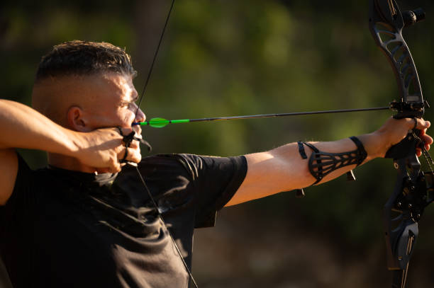 istock A man is shooting an arrow with a green tip 2169979102