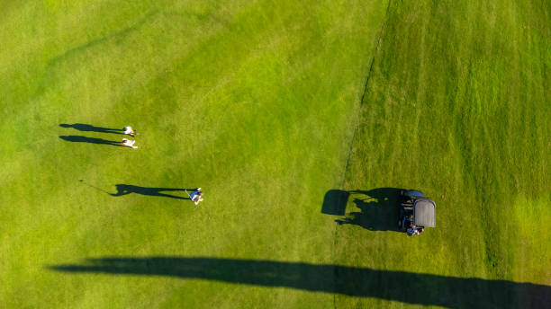 istock People on a green luxury gold course 2169979120