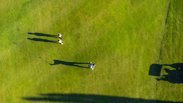 istock People in a green luxury gold course 2169979124