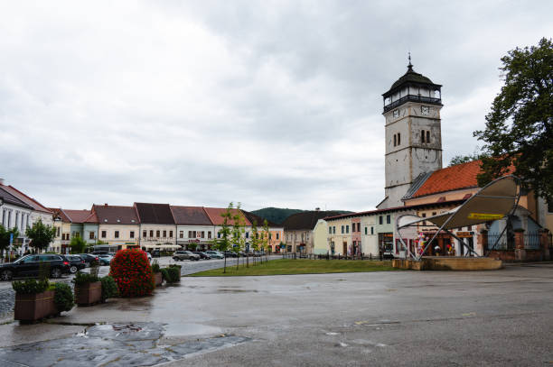 istock historic town square with clock tower and cobblestone streets 2169979752