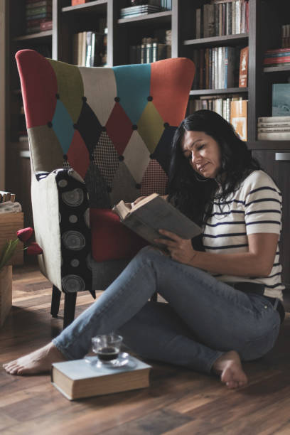 istock A woman is reading a book 2169979899
