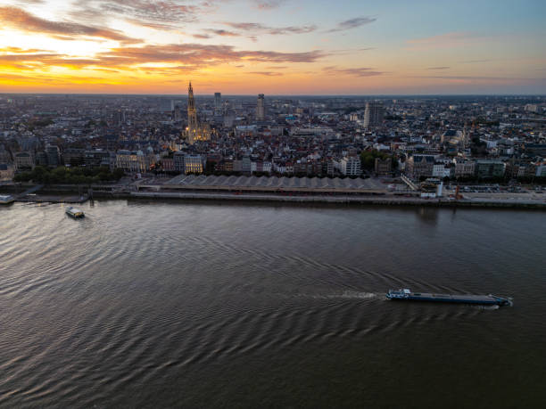 Skyline of Antwerp at dawn, seen from the river “the Schelde”.