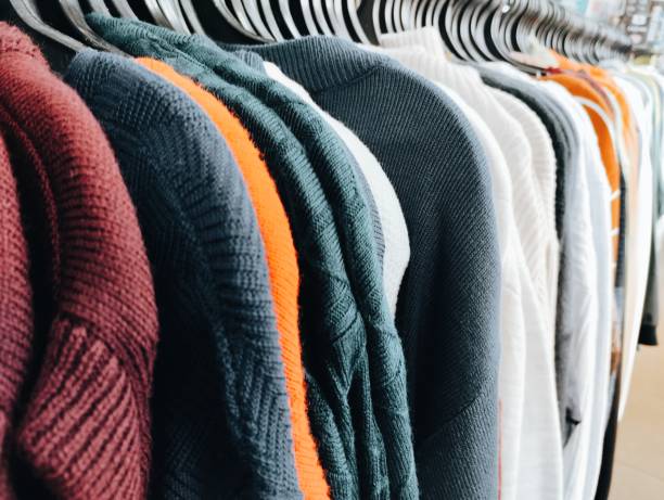 istock selling clothes in a store 2169982643